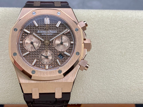 Rose gold chronograph watch with dark dial, subdials, and brown leather strap, front view