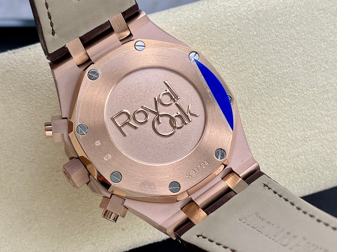 Rose gold watch case with engraved back and brown leather strap, close-up angle