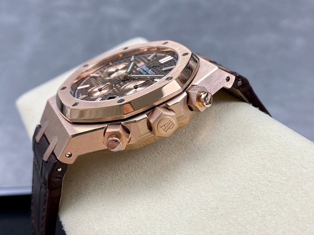 Rose gold wristwatch side profile with crown and pushers, leather strap visible