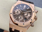 Rose gold luxury chronograph watch with dark dial and leather strap, close-up front