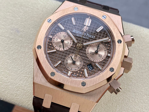 Rose gold luxury chronograph watch with dark dial and leather strap, close-up front