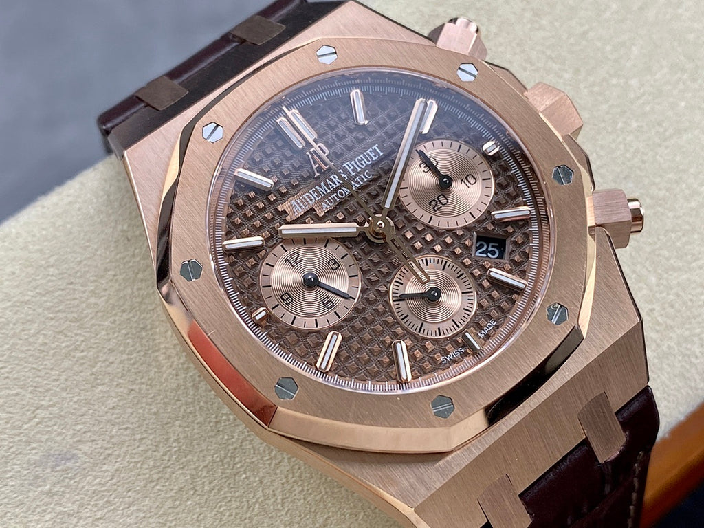 Rose gold luxury chronograph watch with dark patterned dial and leather strap, angled front