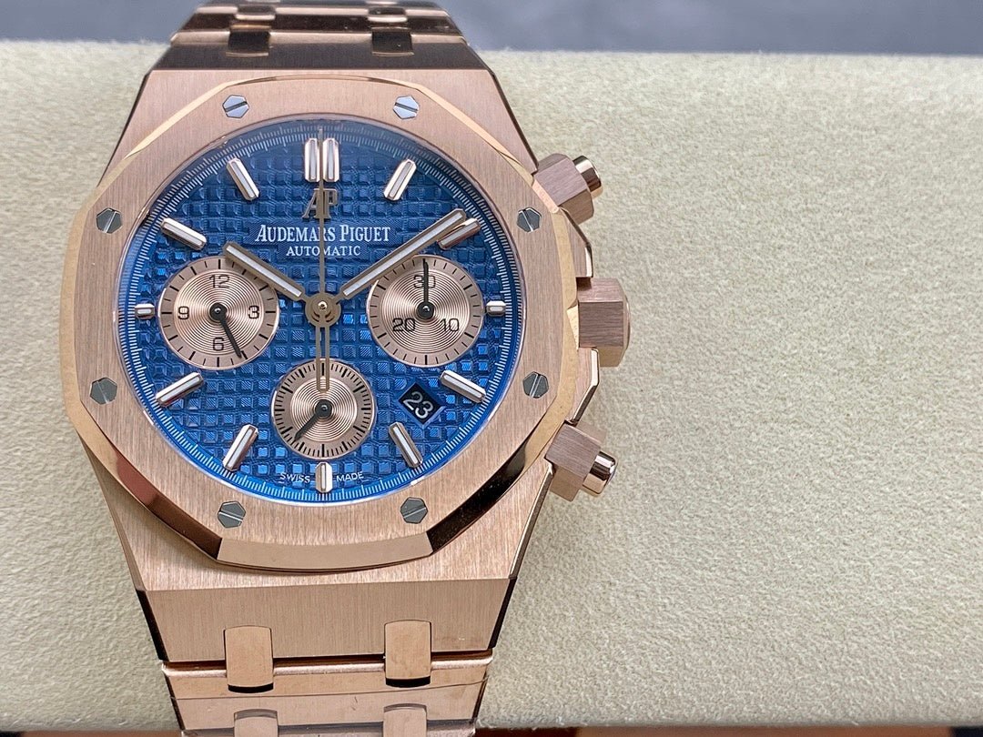 Blue dial chronograph wristwatch with rose-gold case, crown, and integrated bracelet