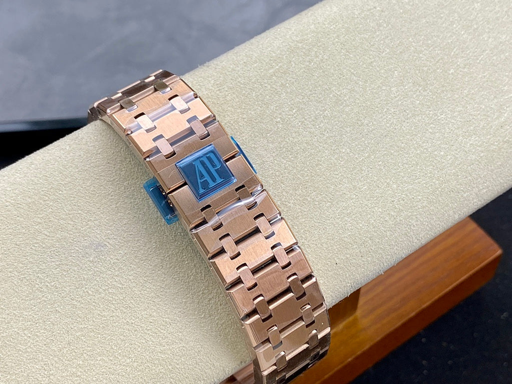 Rose-gold chronograph wristwatch bracelet with blue inner panel and AP-style clasp