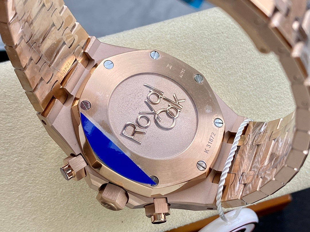 Rose-gold wristwatch caseback with engraved logo and blue sapphire window