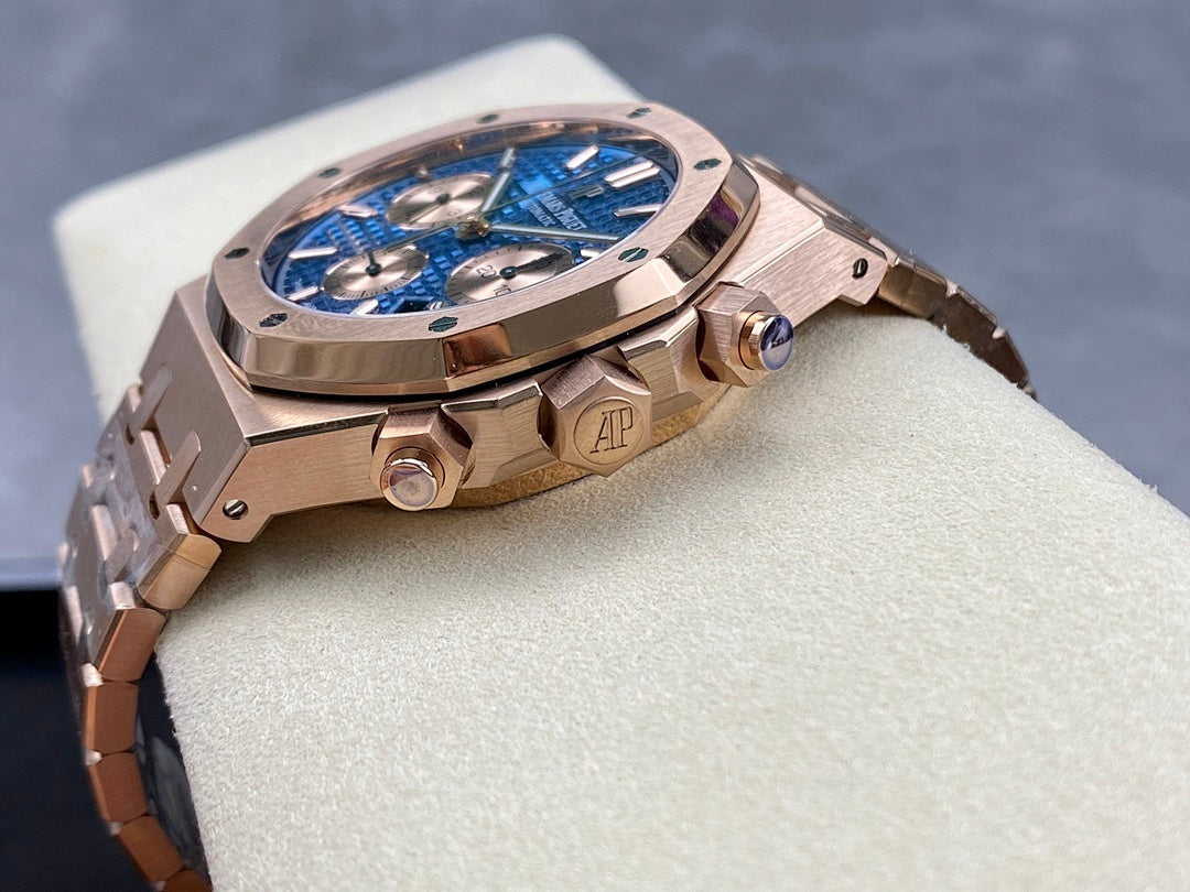 Rose-gold chronograph wristwatch with visible crown and blue dial through open case angle