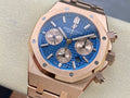 Blue dial chronograph wristwatch with rose-gold case and three subdials
