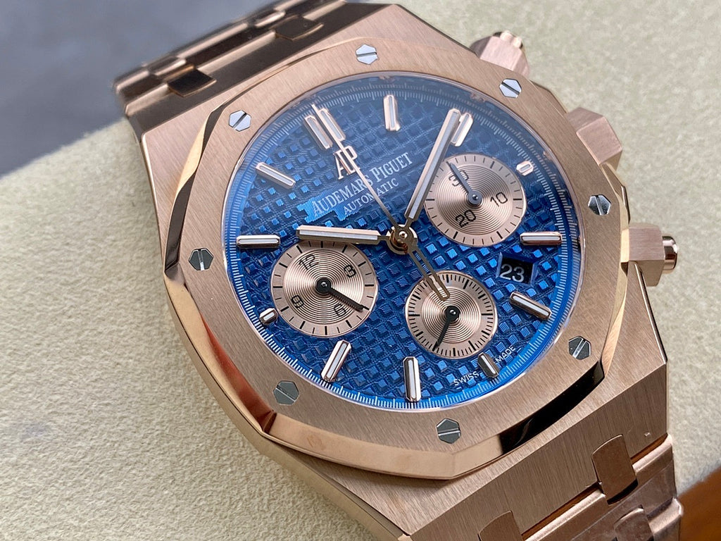Blue textured dial chronograph wristwatch with rose-gold bezel and three subdials