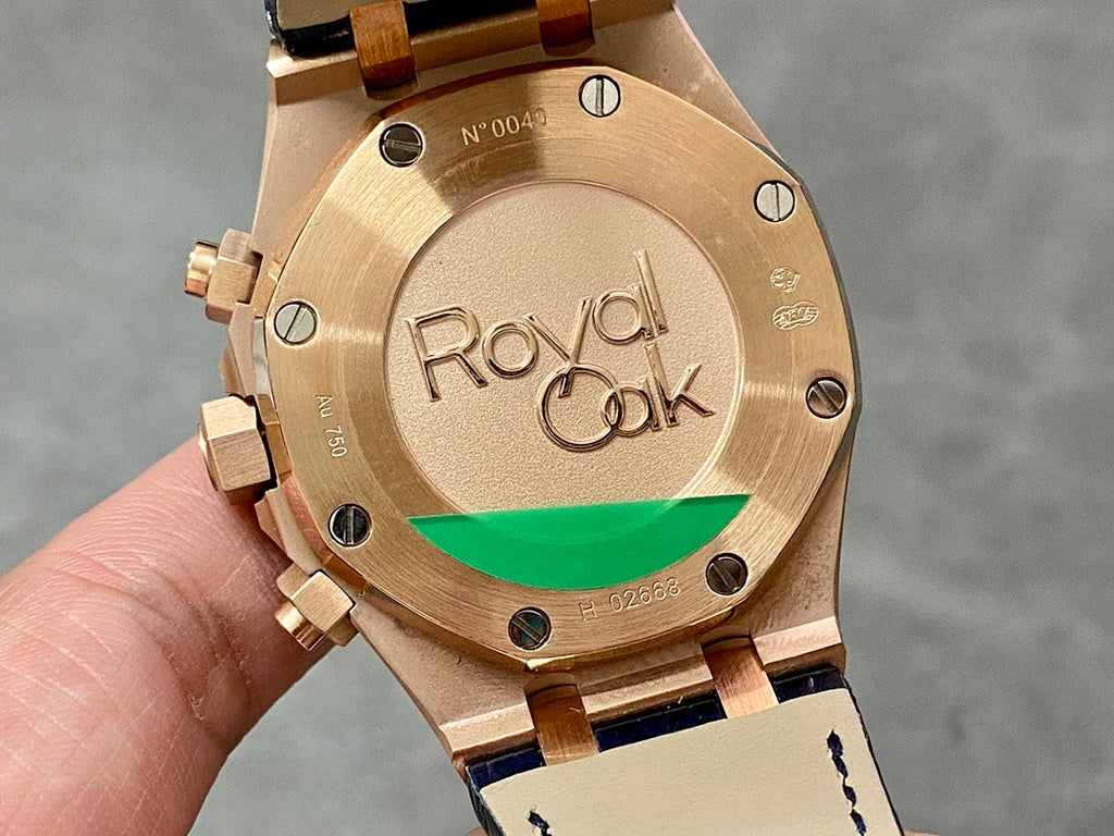 Audemars Piguet Royal Oak watch case back, gold tone with 'Royal Oak' engraving