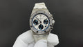 Audemars Piguet watch with silver bezel, blue dial, and white rubber strap