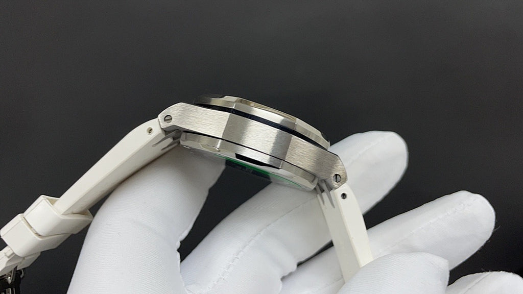 Audemars Piguet watch top view with stainless bezel and crown-side accents