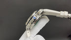 Audemars Piguet watch side view with three-link look and white rubber strap