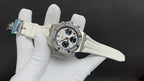 Audemars Piguet watch on white strap with dark blue chronograph dials