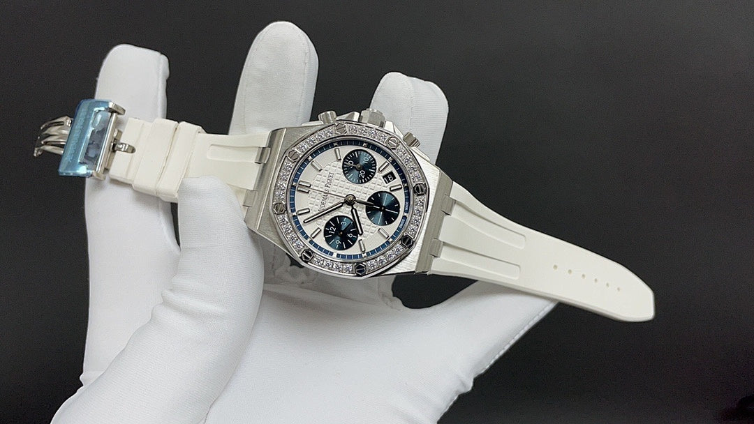 Audemars Piguet watch on white strap with dark blue chronograph dials
