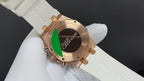 Audemars Piguet watch case back in gold with screws; on white rubber strap
