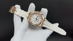 Audemars Piguet watch with white dial and gold case, diamond bezel, white rubber strap