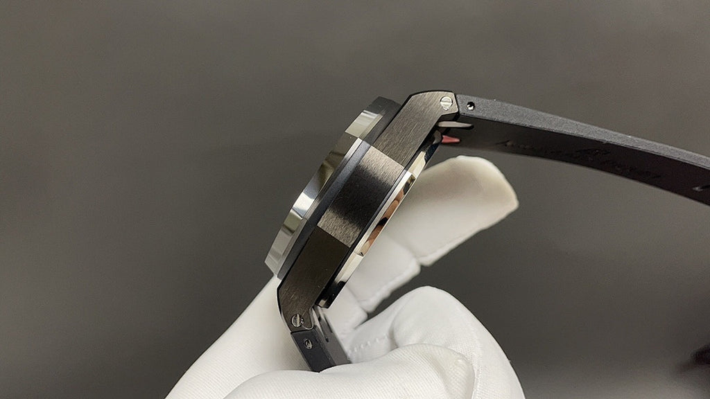 Audemars Piguet wristwatch side view, steel case with dark bracelet