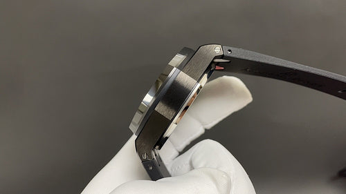 Audemars Piguet wristwatch side view, steel case with dark bracelet