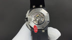 Audemars Piguet wristwatch caseback, visible movement, steel case with dark strap