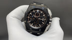 Audemars Piguet wristwatch front, black dial with gold accents and steel bezel