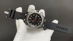 Audemars Piguet wristwatch on dark silicone strap, black dial with gold accents