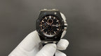 Audemars Piguet wristwatch front view, black dial, steel case, dark bracelet