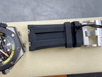 Luxury watch case with dark rubber strap and metal buckle clasp