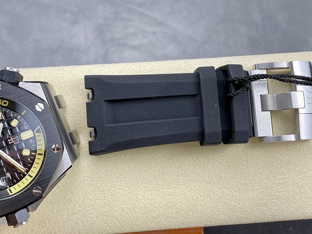 Luxury watch case with dark rubber strap and metal buckle clasp