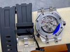 Luxury sports watch with transparent caseback and dark rubber strap