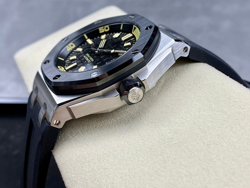 Luxury sports watch with dark dial, yellow indices, and dark rubber strap from side