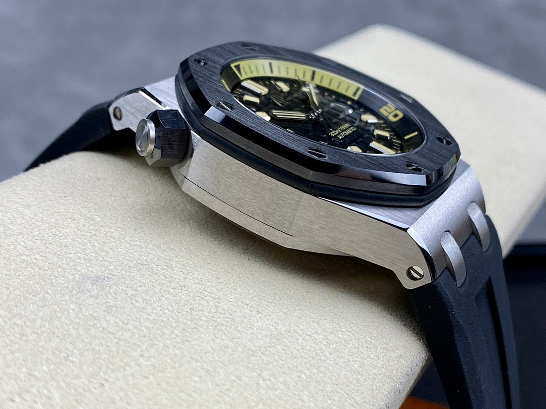 Luxury sports watch with dark dial and dark rubber strap shown at a three-quarter angle