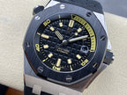 Luxury sports watch with dark dial, yellow markers, and dark rubber strap on display