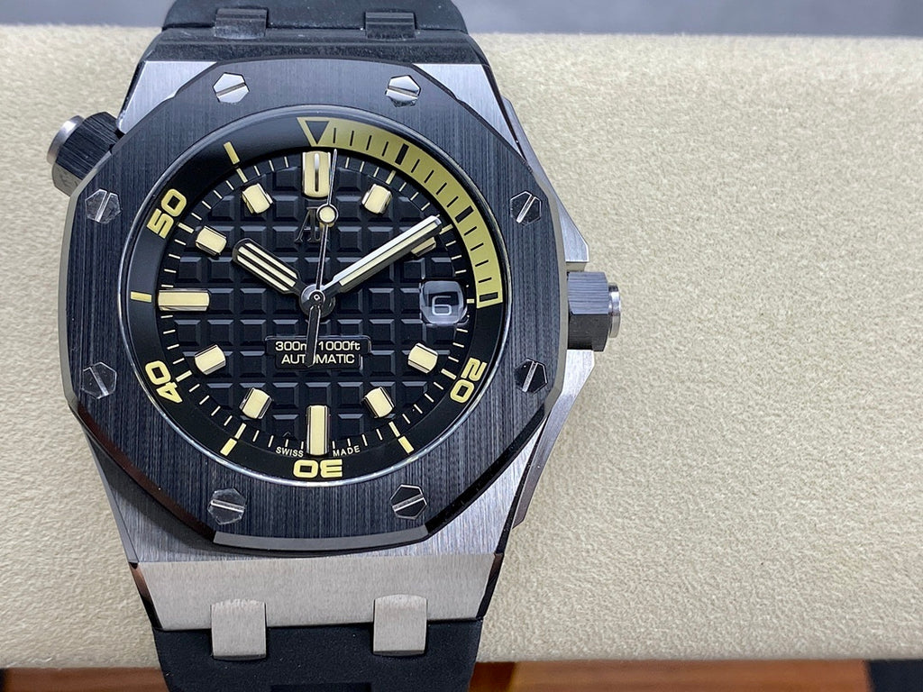 Luxury sports watch with dark dial, yellow markers, and dark rubber strap, straight-on view