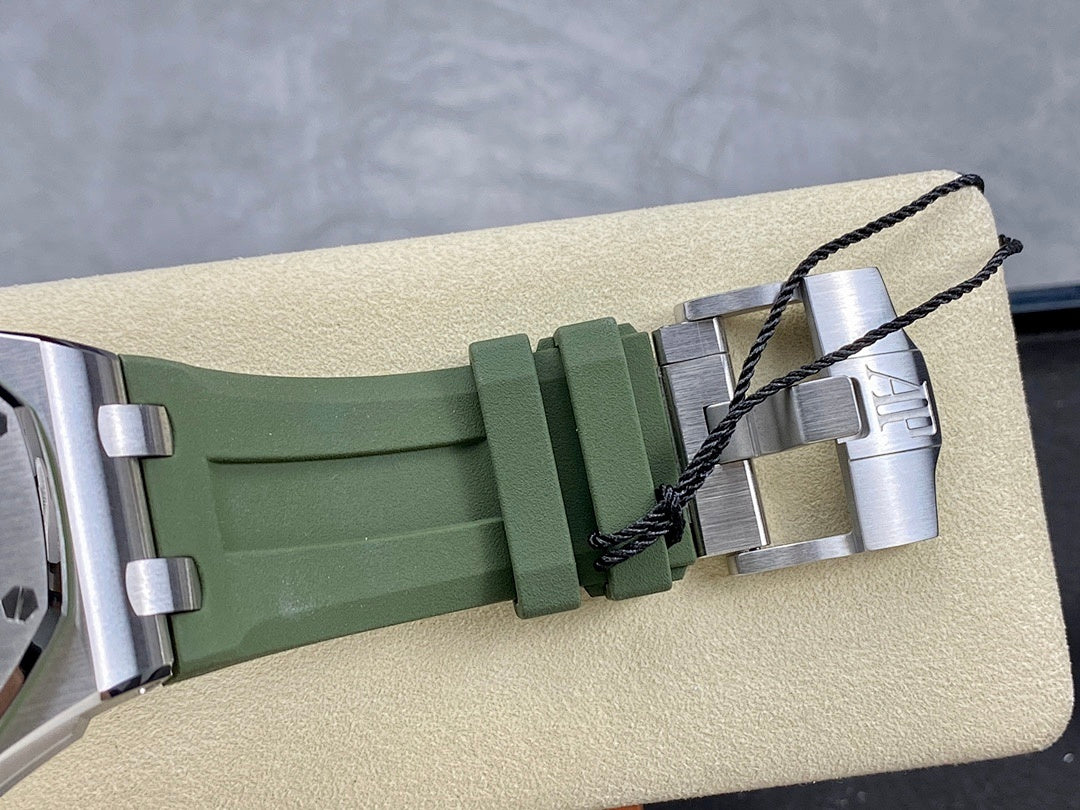 Green silicone watch strap with metal clasp and stitched black cord detail
