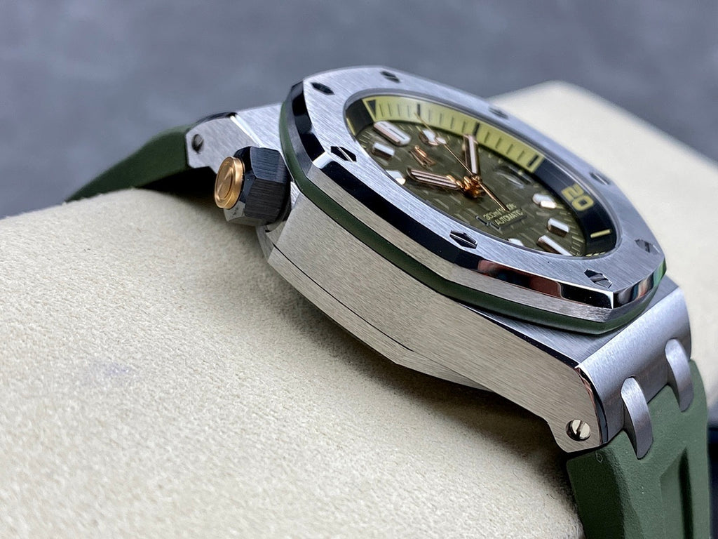 Sports watch angled view with green dial, metal case, crown detail, green rubber strap