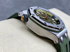 Sports watch angled view with green dial, metal case, crown detail, green rubber strap