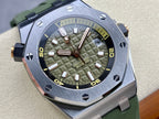 Sports watch close-up with green dial, raised hour markers, rose-gold hands, metal case