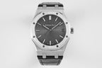 Audemars Piguet watch with dark dial, silver bezel, and black rubber strap