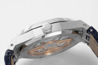 Audemars Piguet watch case close-up showing mechanical movement through window