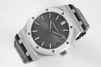 Audemars Piguet watch angled view with dark dial, silver bezel, black strap