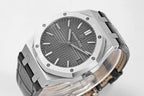 Audemars Piguet watch top view with dark dial and black rubber strap