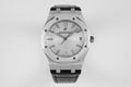 Audemars Piguet watch with silver dial, black leather strap, octagonal steel case