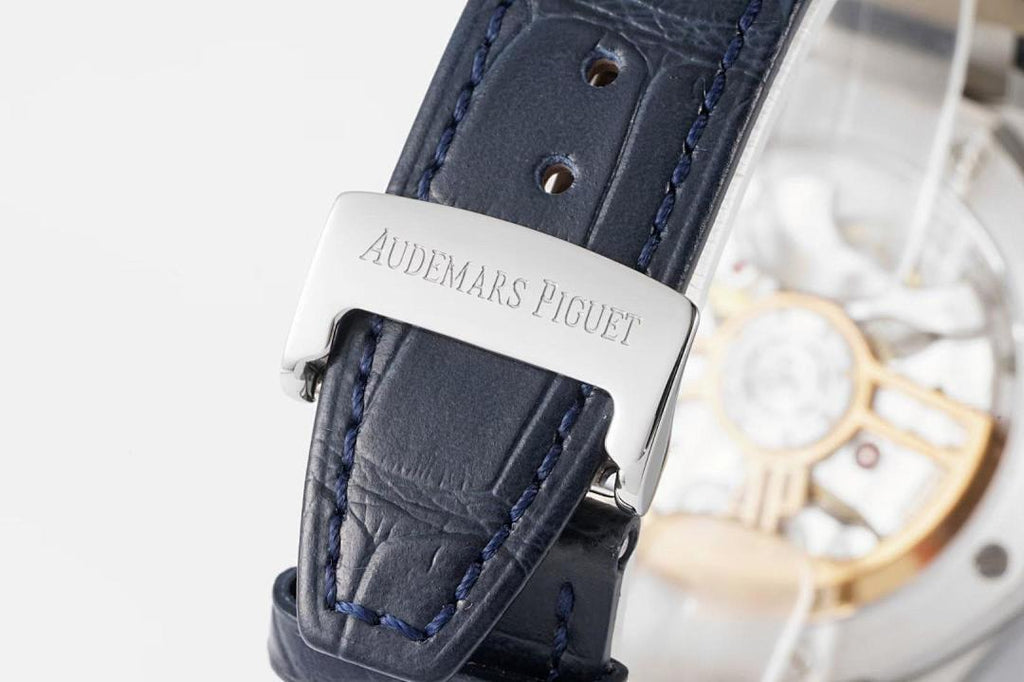 Audemars Piguet Royal Oak watch with blue leather strap and engraved steel buckle