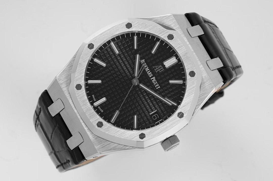 Stainless steel wristwatch with black textured dial and black leather strap