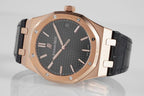 Audemars Piguet Royal Oak watch with rose gold case, dark dial, and black leather strap.