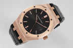 Audemars Piguet watch with rose gold octagonal case, black dial, and black leather strap.