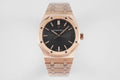 Audemars Piguet rose-gold wristwatch with black dial and metal bracelet