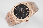 Audemars Piguet rose-gold wristwatch with black dial, hour markers, metal bracelet