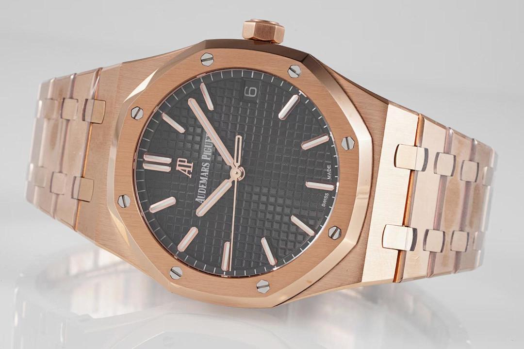 Audemars Piguet rose-gold wristwatch with black textured dial and metal bracelet