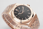 Audemars Piguet rose-gold wristwatch close-up of black dial and indices